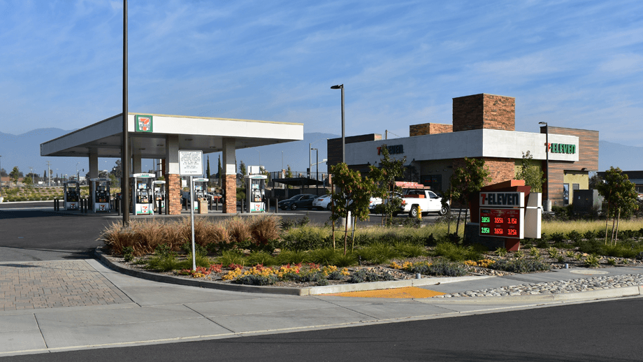 Outdoor image of 7-11 next to a gas station.