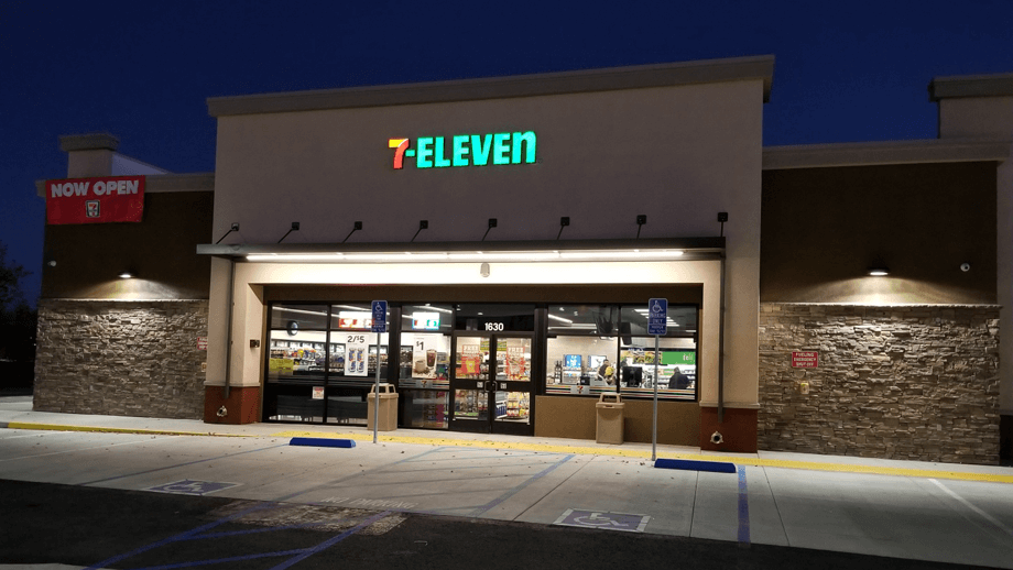 Outdoor image image of 7-11 showing main entrance and parking lot.