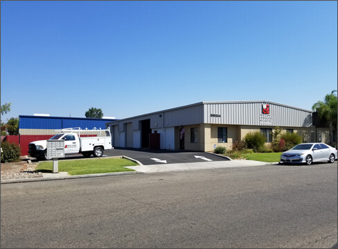 Outdoor image of the West Coast Construction buiding showing the side of the building.